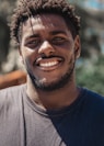 selective focus of man smiling during daytime