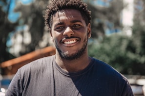 selective focus of man smiling during daytime