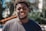 selective focus of man smiling during daytime