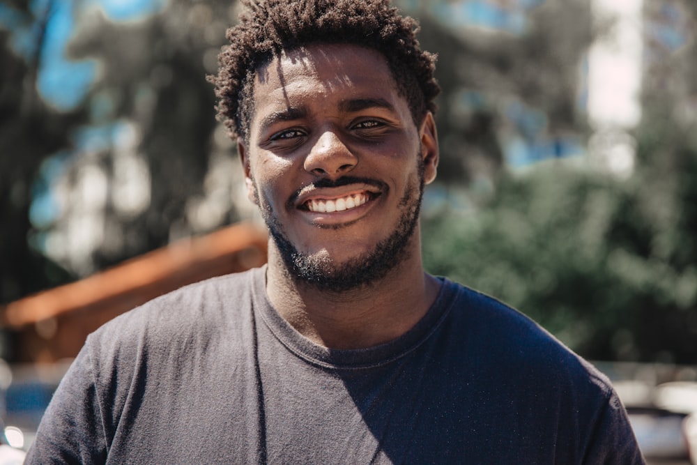 selective focus of man smiling during daytime