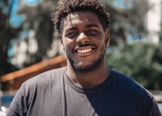 selective focus of man smiling during daytime