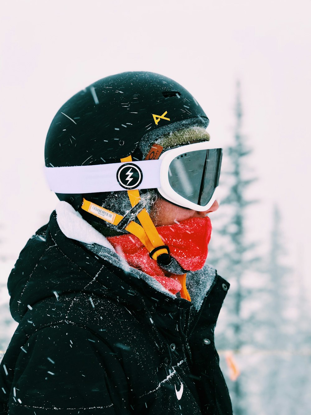 person wearing white snow goggles