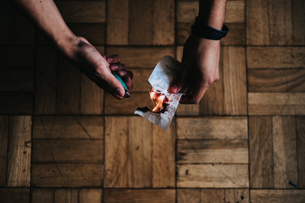 person burning paper