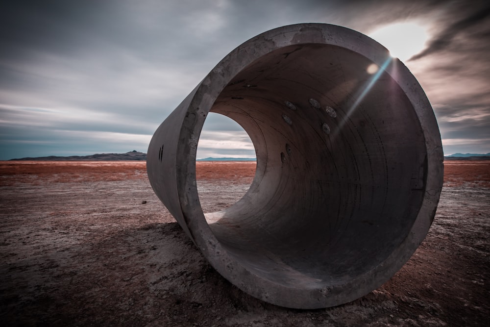 brown concrete arch on brown sand during daytime