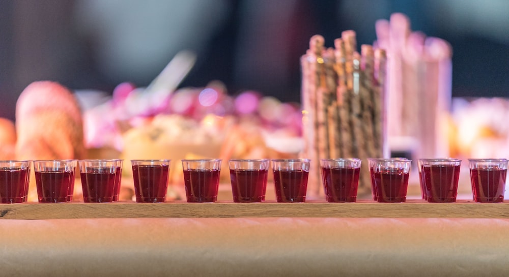 shot glasses filled with red liquid