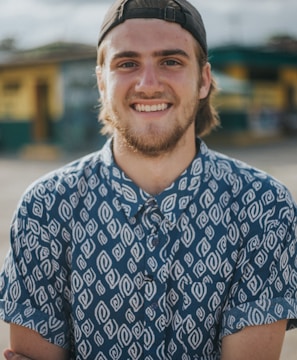 person wearing blue top smiling