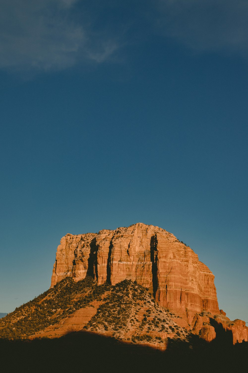 selective focus photography of brown mountain under blue sky