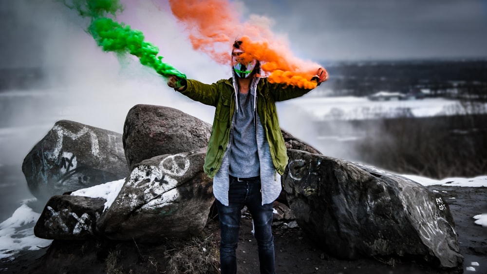 man holding smoke flares