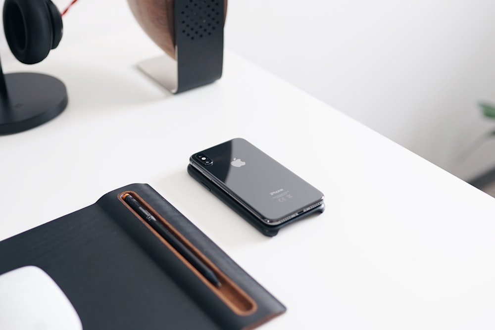 space gray iPhone X on desk