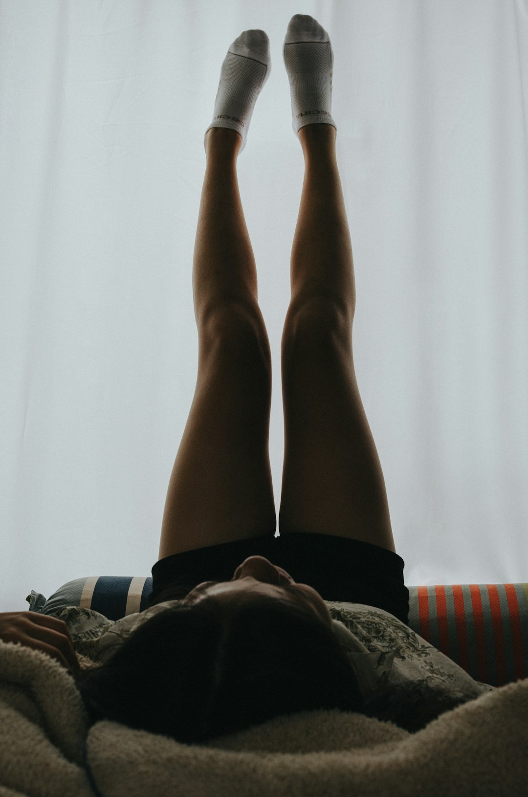 woman laying on the bed