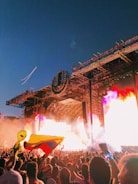 people watching fire bursting on stage
