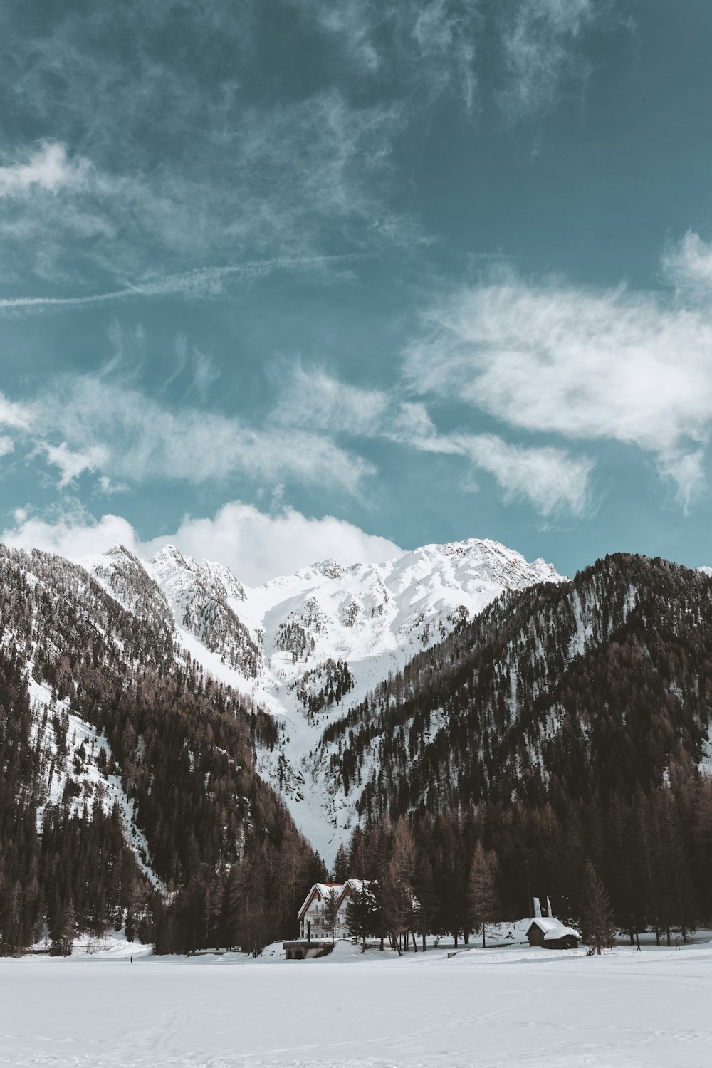 low-angle photography of house on snowy mountain slope