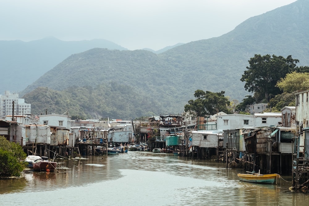 wooden shanties along the riverbank