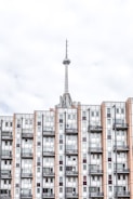 brown and white painted building and tower at daytime