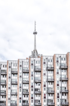 brown and white painted building and tower at daytime