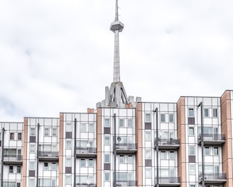 brown and white painted building and tower at daytime