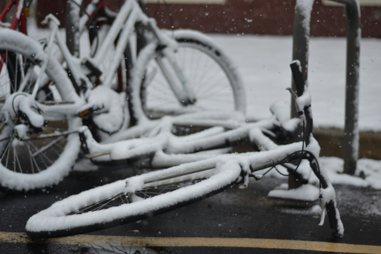 Nikon D3100 + Nikon AF Nikkor 50mm F1.8D sample photo. Two snow covered bicycle photography