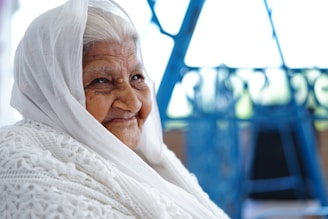 close-up photo of woman sitting while smiling