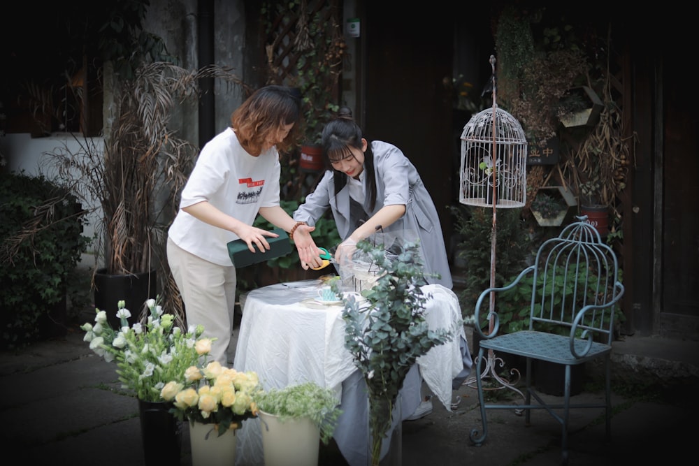 two woman using bottle