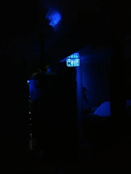 Creative multimedia content displayed on various digital devices in a blue-toned environment.