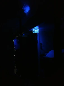 Creative multimedia content displayed on various digital devices in a blue-toned environment.