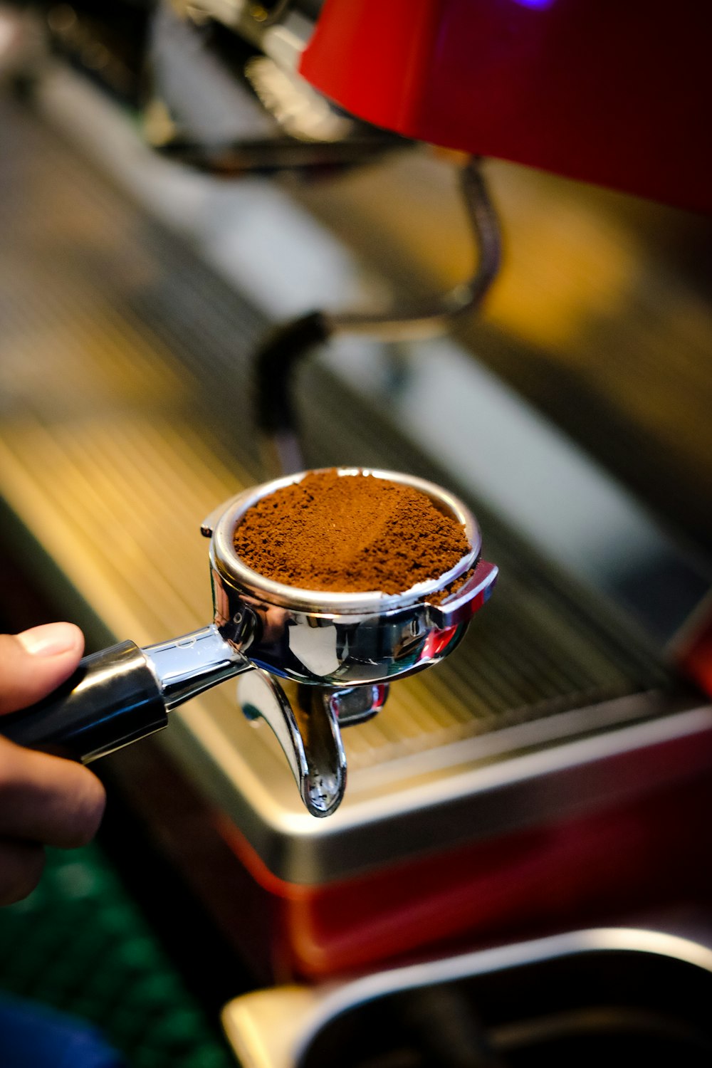 person holding the espresso portafilter