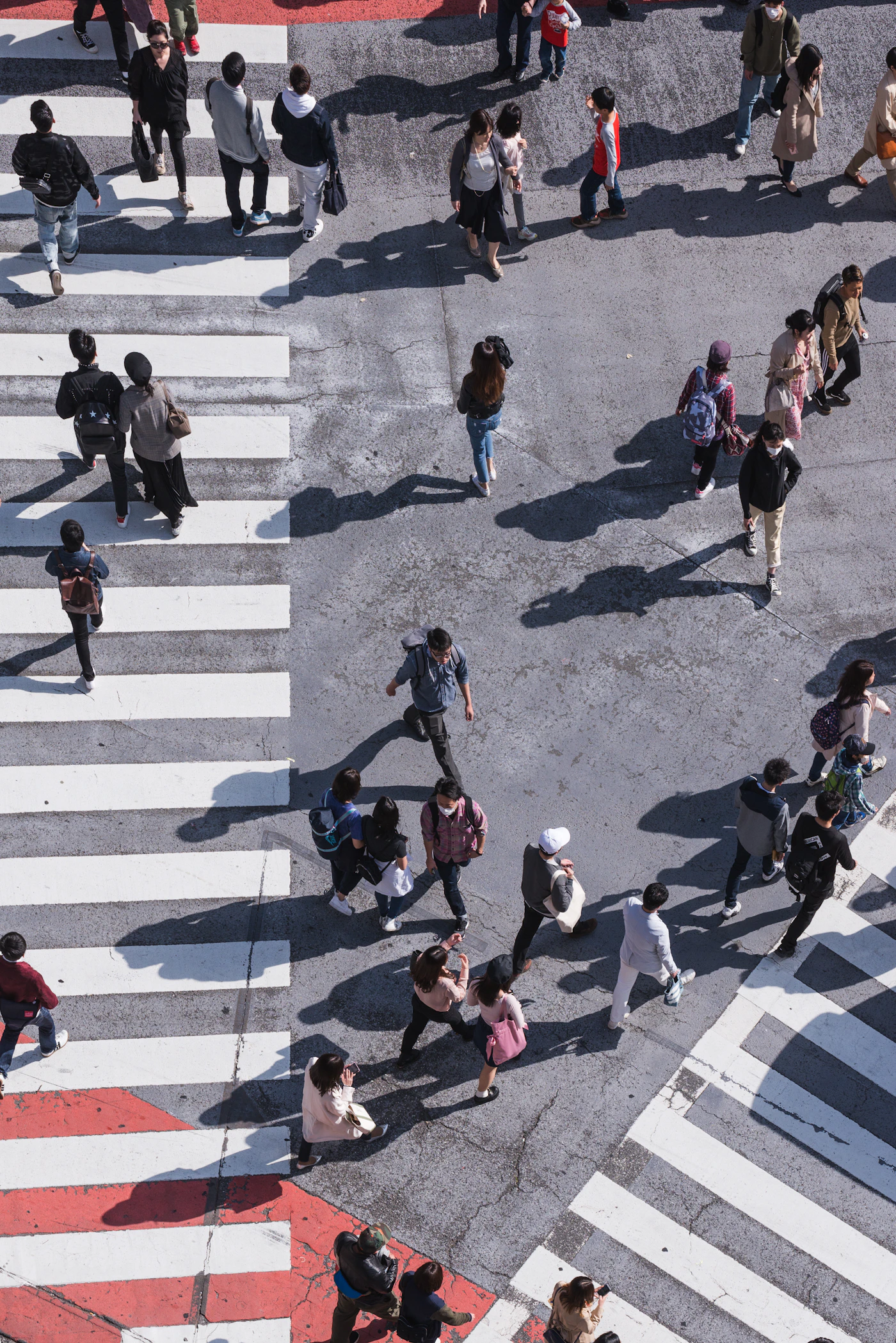 Pedestrians on a zebra crossing seen from directly above