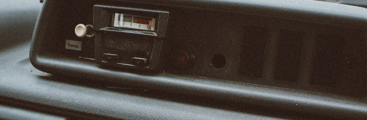 person inserting cassette tape on cassette player