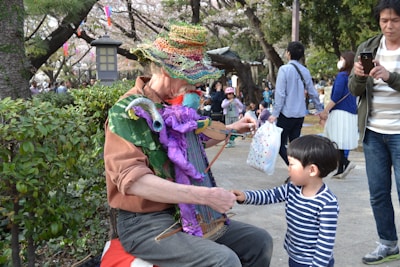 Elder and child together, passing down German folk songs in a cozy community setting.