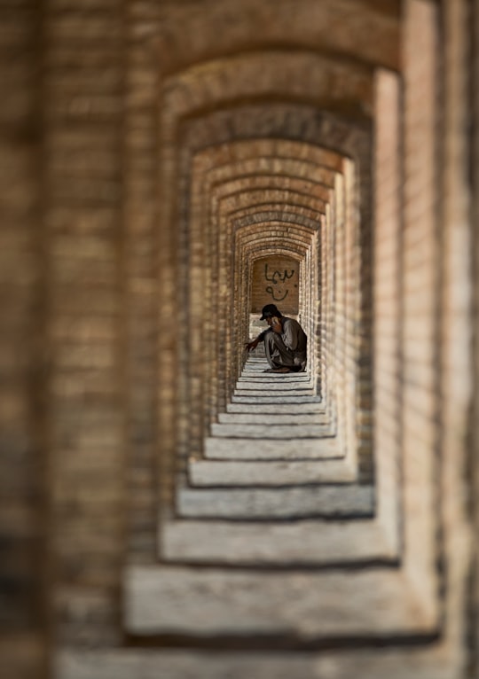 man sitting on floor in Isfahan Iran