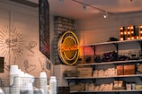 red and yellow Biscuits neon light signage hanged on gray brick wall