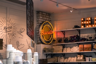 red and yellow Biscuits neon light signage hanged on gray brick wall