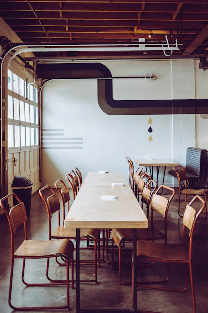 brown chairs arranged in front of brown table