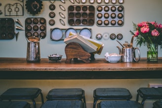 books in middle of pots on table