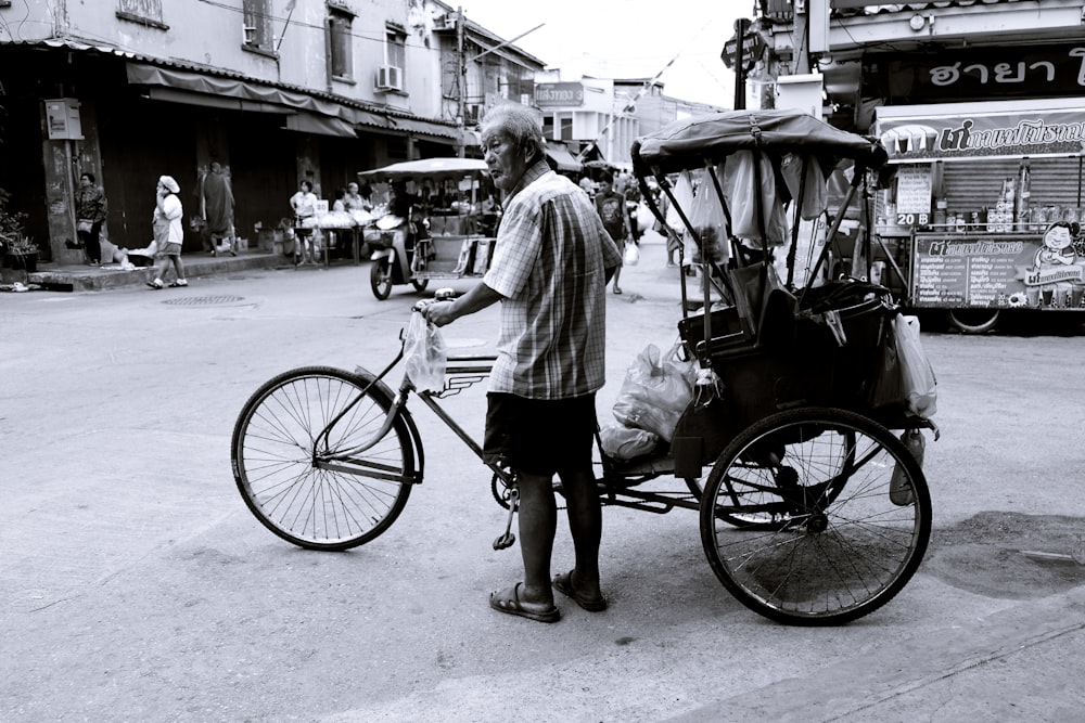 man holding his cruiser trike