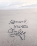 Good Vibes Only sand text