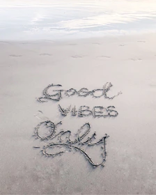 Good Vibes Only sand text