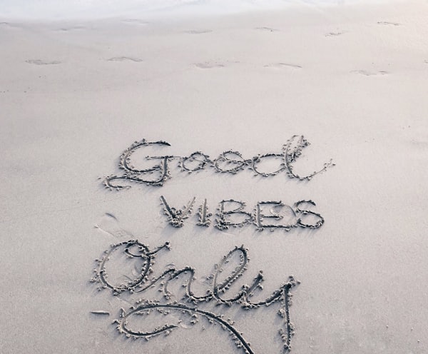 Good Vibes Only sand text