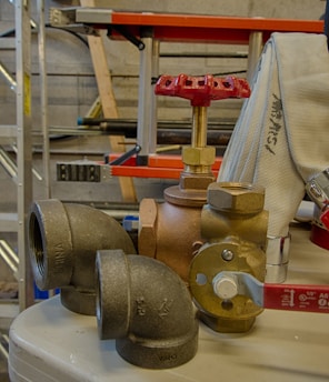 A display of various hydraulic hoses and fittings.