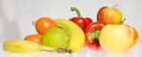 Colorful fruits and vegetables arranged on a kitchen counter.
