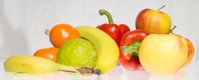 Colorful fruits and vegetables arranged on a kitchen counter.