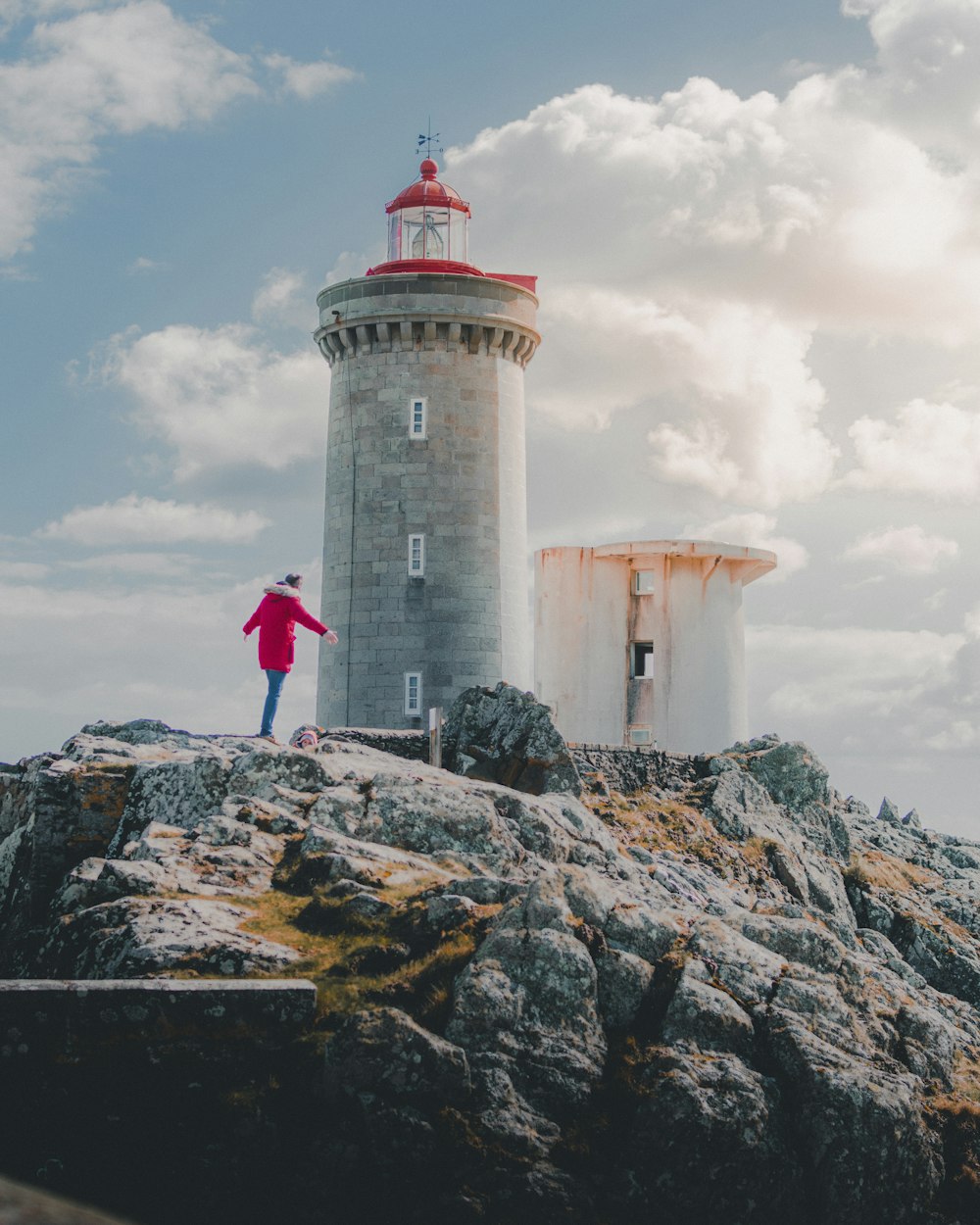 person standing near the lighthouse