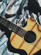 brown cut-away guitar