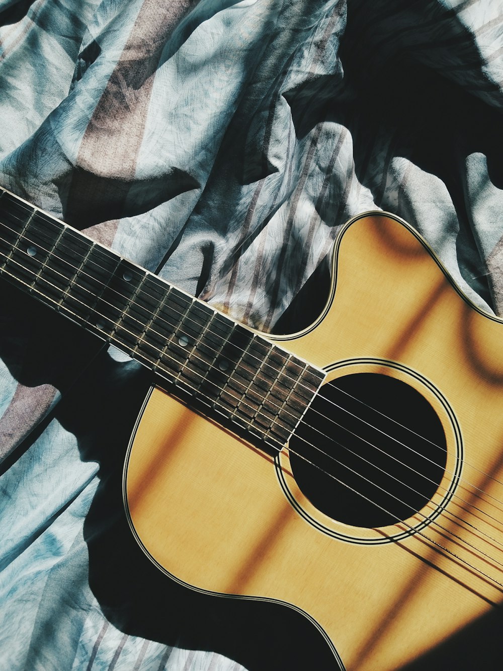 brown cut-away guitar