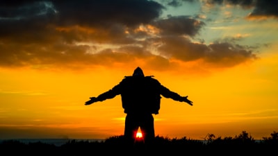 silhouette of man spreading its arm inspired google meet background