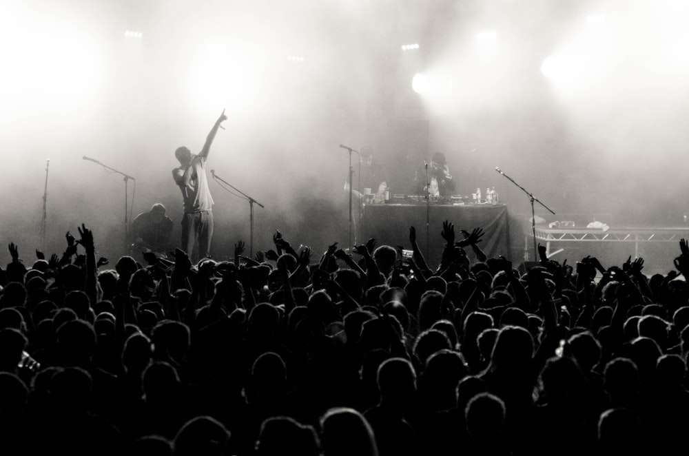 grayscale photo of people in concert
