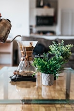 person pouring coffee ion jar