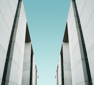 two white buildings facing each other