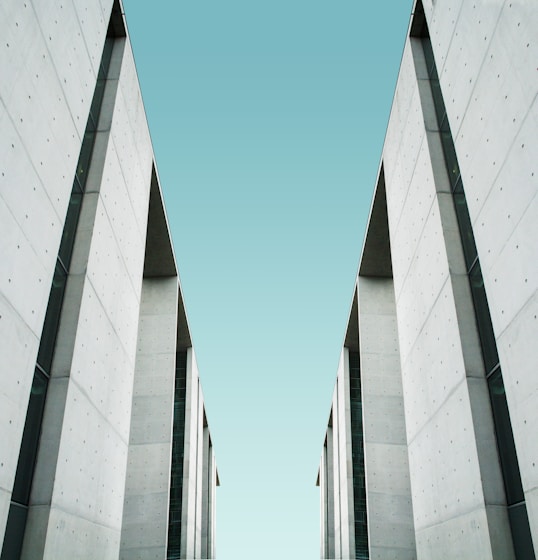 two white buildings facing each other