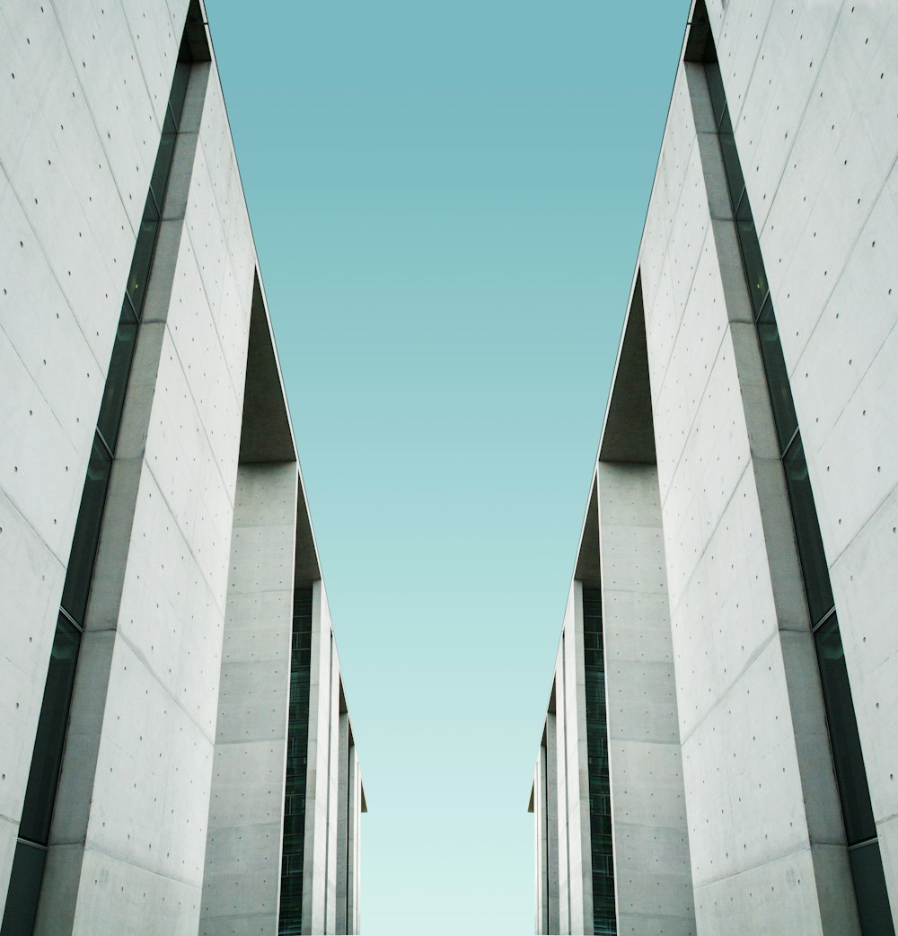 two white buildings facing each other